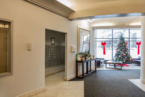 a christmas tree in the lobby of a building