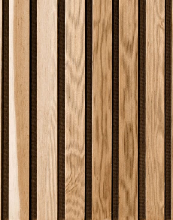 a close up of a wooden wall with brown stripes