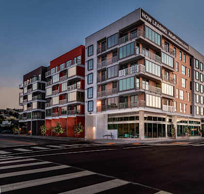 A modern multi-story building with the words "OW Leasing" on the top.