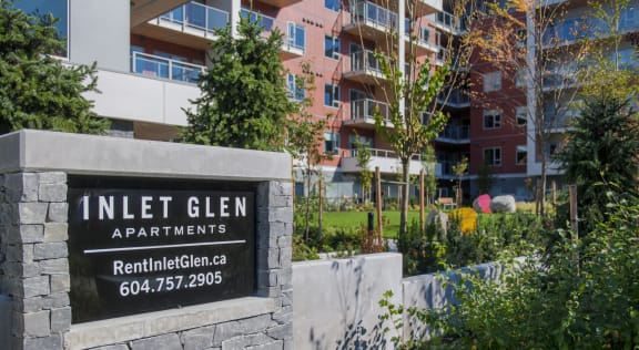 an apartment building with a sign that reads apartments