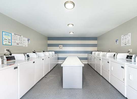 the laundry room is equipped with washers and dryers at Colima Terrace Apts, Rowland Heights, CA