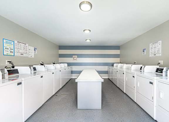 the laundry room is equipped with washers and dryers at Colima Terrace Apts, Rowland Heights, CA
