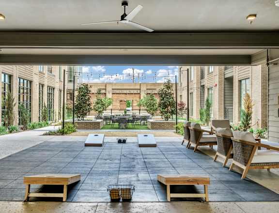 A patio with a table and chairs is shown.