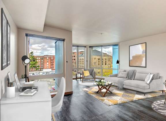 Living room with couch and large windows