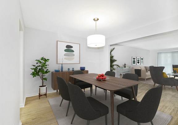 A dining room with a wooden table and chairs.