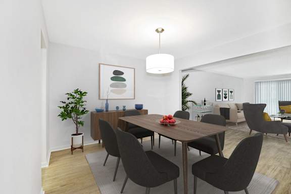 A dining room with a wooden table and chairs at Glens of Bloomfield Apartments, Bloomfield Hills