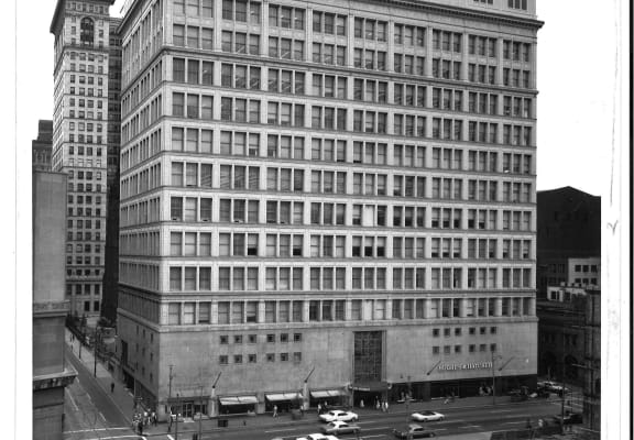 an old black and white photo of a large building