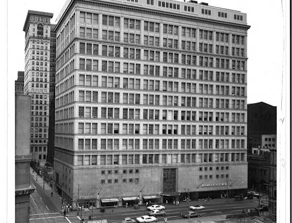 an old black and white photo of a large building