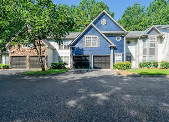 front of apartment building with garages