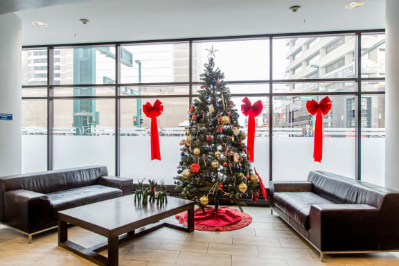 a christmas tree in the lobby of a building