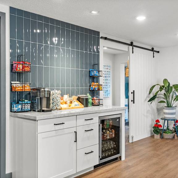 A kitchen with a white fridge and a white oven.