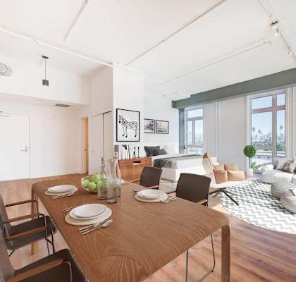 A dining room with a wooden table and chairs.at 2231 S Western, California