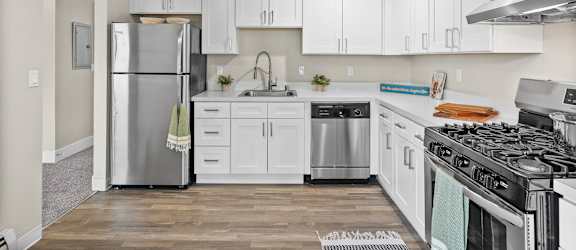 Kitchen with Equipments and cabinetry at Timbre Apartments, Lakewood