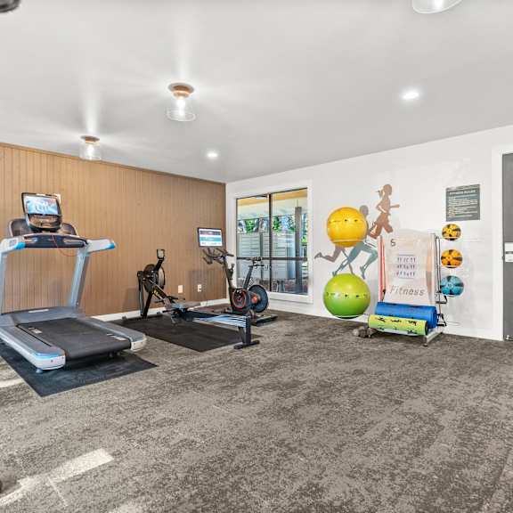 Gym with Treadmills and cardio machines at Timbre Apartments, Lakewood, Washington