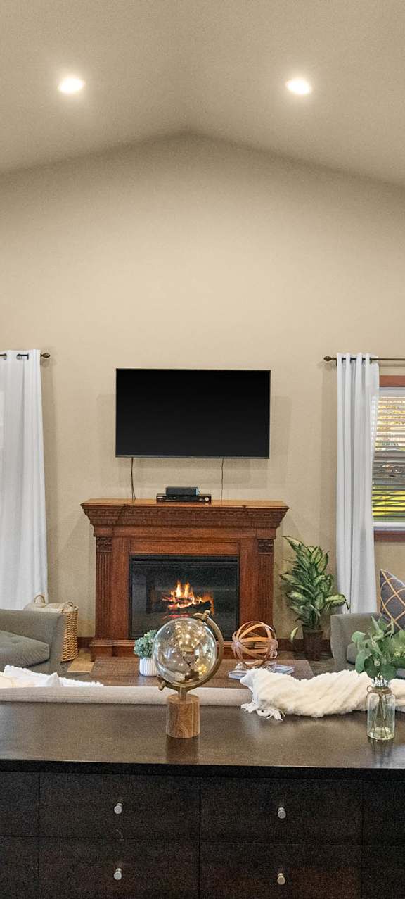 Living Room with Fireplace and TV at Harbor Oaks, Washington