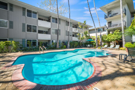 a large swimming pool in front of an apartment building at Sunset Barrington Gardens, Los Angeles, California