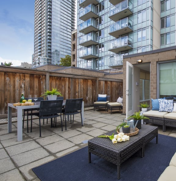 a living room with a couch and a table and a patio