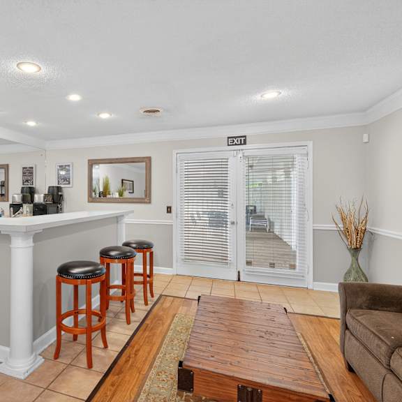 A living room with a dining table and chairs. at The Landing Townhomes Apartments, Hanahan, SC