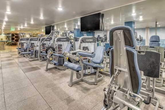 a group of exercise equipment in a gym  at Esprit Apartments, Marina del Rey, CA
