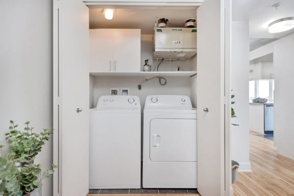 a washer and dryer in a laundry room with white appliances