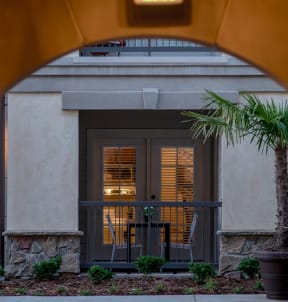 a barbecue grill with a tin roof on a pole at The Villa at River Pointe, Maumelle, AR 72213
