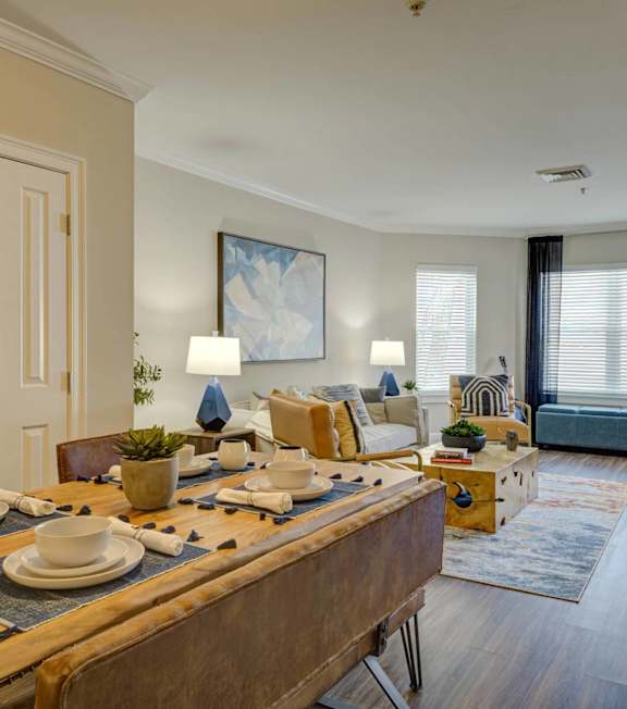 A bathroom with a toilet, sink, mirror, and wall-mounted planters.