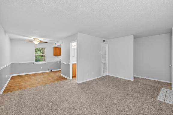 A room with a window and carpeted floor. at The Landing Townhomes Apartments, Hanahan, SC