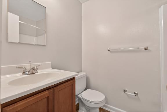 A room with a window and carpeted floor. at Woodlocke Apartments, South Carolina, 27461