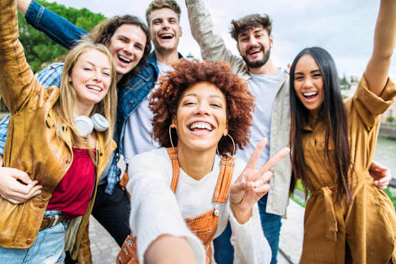 A group of friends are taking a selfie together.