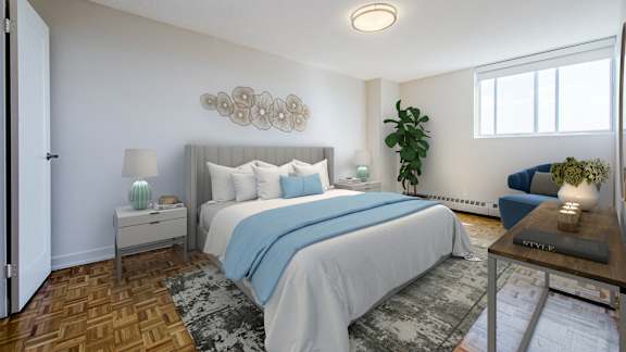 a bedroom with a large bed and a couch