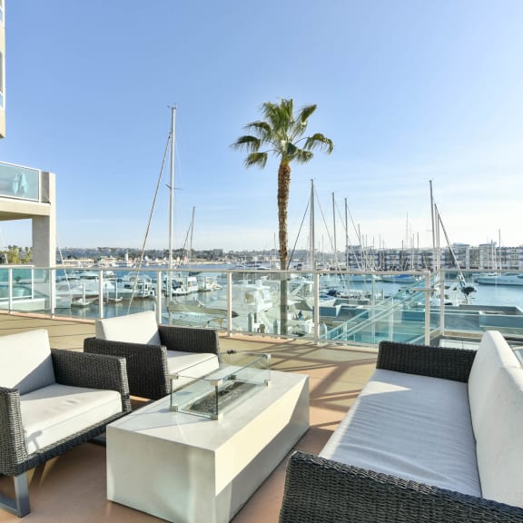 a seating area at a resort with a palm tree  at Esprit Apartments, Marina del Rey, California