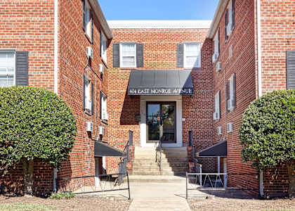 The front of a brick building with a sign that says 40th East Mornge Avenue.