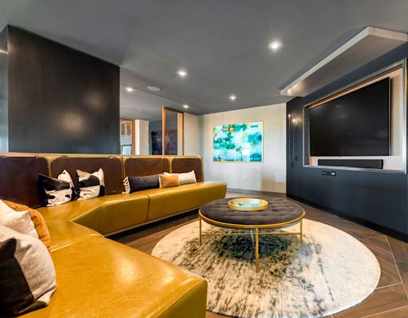 a living room with couches and a television