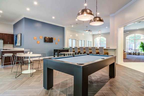 play a game of pool in our clubhouse at our apartments