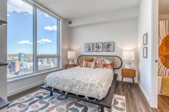 a bedroom with a large window and a bed at BLVD Beltline, Calgary, Alberta, T2G 2K4