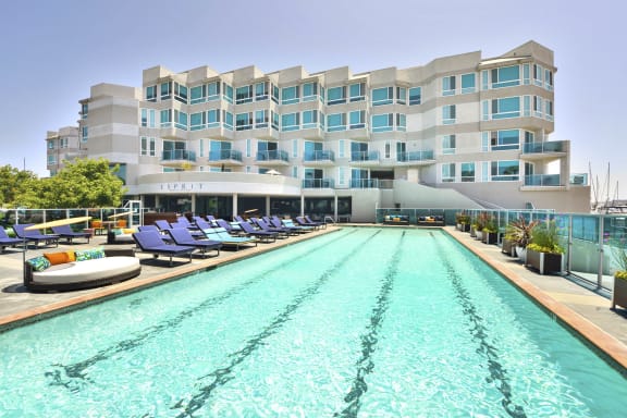 a hotel swimming pool with a building in the background  at Esprit Apartments, Marina del Rey, CA, 90292