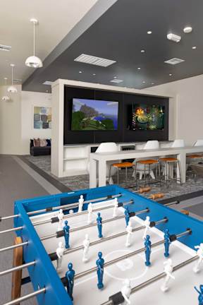 Foosball table in community resident lounge at Element 12 Henderson apartments