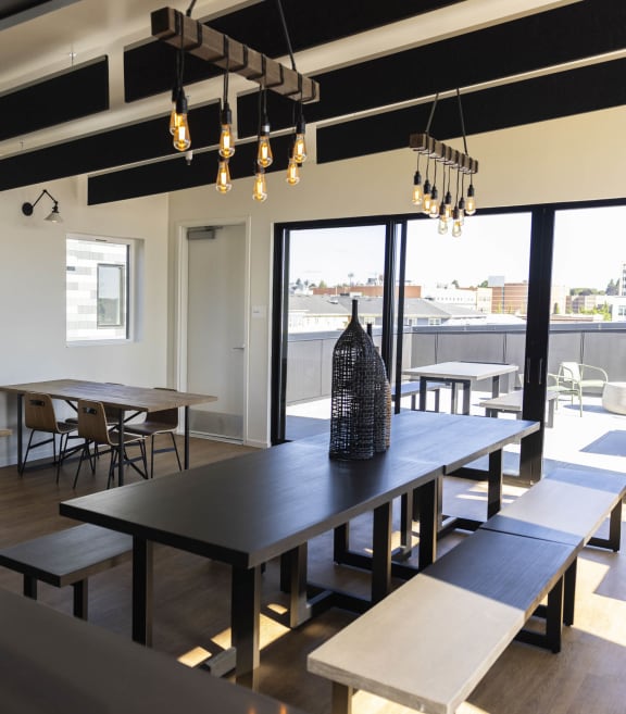 a rendering of a dining room with people sitting at a table at Moraine, Tacoma