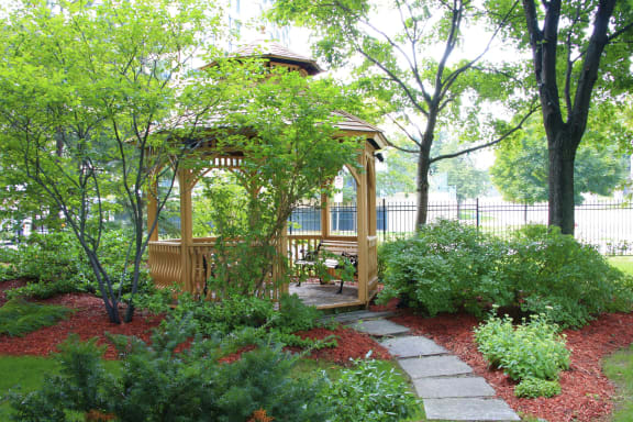 a gazebo in the middle of a garden