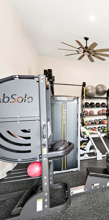 the gym at the enclave at woodbridge apartments in sugar land, tx
