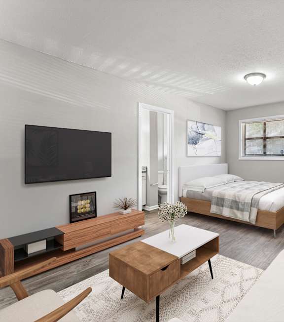 our apartments offer a living room with a couch and a tv at Balfour 296 Apartments in Lilburn, 30047