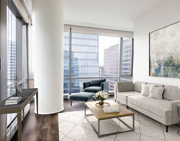 a living room with a large window and a couch and a table