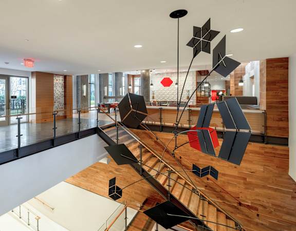 a large lobby with a sculpture in the middle of it at The Bartlett in Arlington, VA 22202