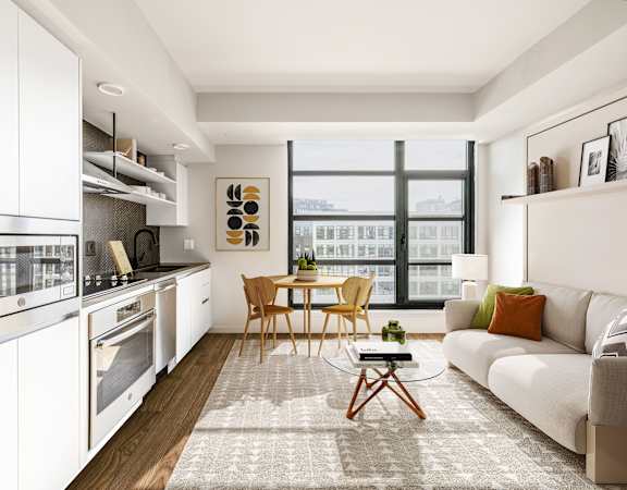 a living room with a couch and a table and a window