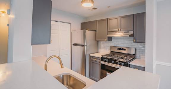 a kitchen with stainless steel appliances and a white counter top at Ardenwood Apartments, North Haven, 06473