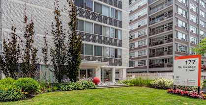 A building with the number 177 on it is surrounded by greenery. at 177 Saint George in Toronto, CA