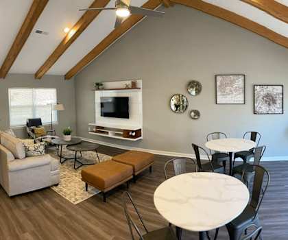 a living room with a couch and a table and a television