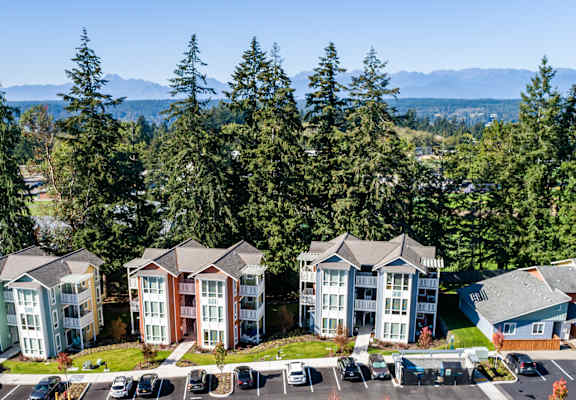 an aerial view of a group of houses in a parking lot at Woodcreek, Poulsbo, WA 98370