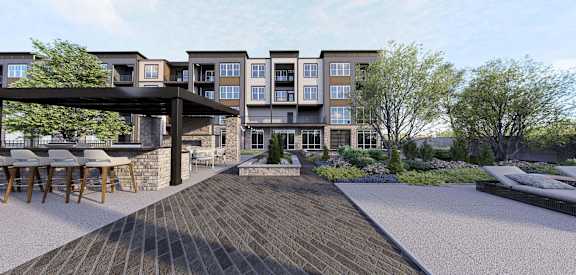 A modern building with a patio and a bar. at Stack at Wheat Ridge Apartments, Apartments, Wheat Ridge, CO