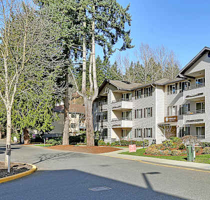 an empty street in front of an apartment building  at Townside Flats, Redmond, Washington